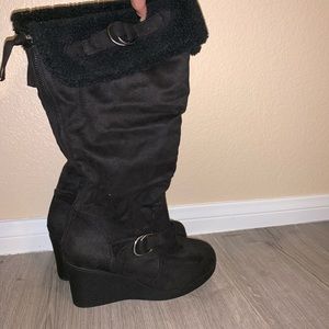 Knee-high furry boots.